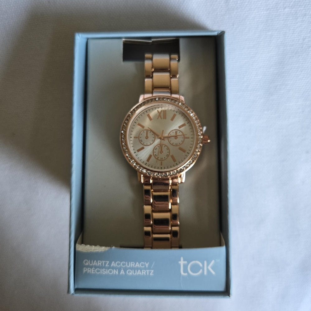 NIB gold colored watch